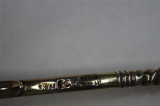 A Russian 84 zlotnik silver gilt and niello spoon, assay master probably Andrei Koralsky, 1842, L 17.5cm and four other Russian spoons